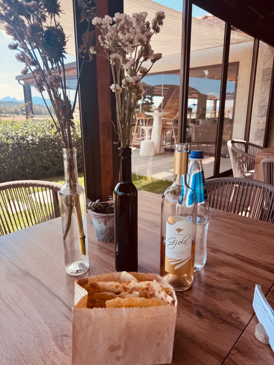 Surrau rosato, water and crisp bread on the lunch table